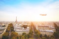 Travel to France, airplane flying over beautiful panoramic cityscape of Paris
