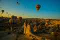 Travel to Goreme, Cappadocia, Turkey. Hot air balloons landing in a mountain Cappadocia Goreme National Park Turkey