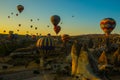 Travel to Goreme, Cappadocia, Turkey. The sunrise in the mountains with a lot of air hot balloons in the sky