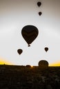 Travel to Goreme, Cappadocia, Turkey. The sunrise in the mountains with a lot of air hot balloons in the sky. Royalty Free Stock Photo