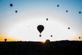 Travel to Goreme, Cappadocia, Turkey. The sunrise in the mountains with a lot of air hot balloons in the sky. Royalty Free Stock Photo