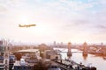 Travel to London by flight, airplane in the sky above Europe