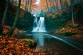 Travel to majestic waterfall in autumn forest, natural beauty Royalty Free Stock Photo
