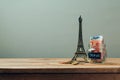 Travel to Paris, France concept with Eiffel Tower souvenir. Planning summer vacation