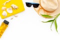 Straw Hat, Sun Glasses, Shells And Sunblock Cream For Sea Vacation On White Background Top View Copy Space
