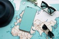 Travel Top view with map and mobile phone hat flat lay for tourism background in blue and teal tone. Royalty Free Stock Photo