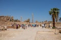 Travel tour group wanders through Karnak Temple. Egyptian landmark with hieroglyphics, decayed Royalty Free Stock Photo