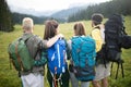 Travel, tourism, hike, gesture and people concept - group of smiling friends with backpacks Royalty Free Stock Photo