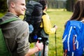 Travel, tourism, hike, gesture and people concept - group of smiling friends with backpacks Royalty Free Stock Photo