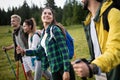 Travel, tourism, hike, gesture and people concept - group of smiling friends with backpacks Royalty Free Stock Photo