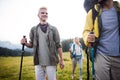 Travel, tourism, hike, gesture and people concept - group of smiling friends with backpacks Royalty Free Stock Photo