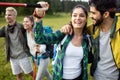 Travel, tourism, hike, gesture and people concept - group of smiling friends with backpacks Royalty Free Stock Photo