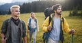 Travel, tourism, hike, gesture and people concept - group of smiling friends with backpacks Royalty Free Stock Photo