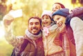 Family taking selfie with smartphone outdoors