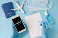 Travel and Tourism Planning after Coronavirus and Quarantine. Hands in disposable gloves hold smartphone Royalty Free Stock Photo