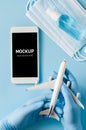 Travel and Tourism Planning after Coronavirus and Quarantine. Hands in disposable gloves hold smartphone Royalty Free Stock Photo
