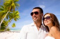 Happy couple in sunglasses over tropical beach Royalty Free Stock Photo