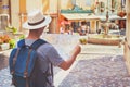 Travel and tourism, tourist looking at map on the street in France, Europe