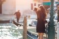 Travel tourist woman on pier against beautiful view on venetian chanal in Venice, Italy. Royalty Free Stock Photo