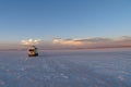 Travel tourist vehicle parked on the Salar de Uyuni Salt Flat or lake in Bolivia, a popular travel destination