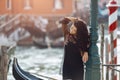 Travel tourist woman on pier against beautiful view on venetian chanal in Venice, Italy. Royalty Free Stock Photo