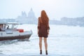 Travel tourist woman on pier against beautiful view on venetian chanal in Venice, Italy. Royalty Free Stock Photo