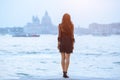 Travel tourist woman on pier against beautiful view on venetian chanal in Venice, Italy. Royalty Free Stock Photo