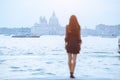 Travel tourist woman on pier against beautiful view on venetian chanal in Venice, Italy. Royalty Free Stock Photo