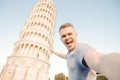Travel tourists Man making selfie in front of leaning tower Pisa, Italy Royalty Free Stock Photo
