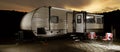 travel trailer with a bright sunset Royalty Free Stock Photo