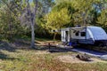 Travel trailer camping in the woods at Branched Oak Lake State Park, Nebraska Royalty Free Stock Photo