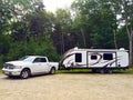 Travel trailer with white pick up truck rest