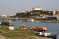 Travel trailers on the banks of the Danube, Bridge SNP left, river Danube and Bratislava castle right, Bratislava, Slovakia Royalty Free Stock Photo