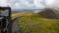 The narrow-gauge railway on Mount Snowdon with clouds and sun. Royalty Free Stock Photo