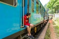 Travel by train in Sri Lanka. A very slow train with no doors. Picturesque places of the island