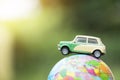 Travel and transport concept. Toy car on world map balloon Royalty Free Stock Photo