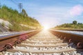 Travel and transportation background concept. Empty railway or railway tracks with blue sky at sunrise. Picture for add text