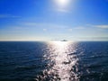 Travel and transportation concept. In the winter morning, the sun is shining on the ship while sailing alone in the deep blue sea Royalty Free Stock Photo