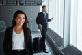 When we travel, we travel in style. two executive businesspeople walking through an airport during a business trip. Royalty Free Stock Photo