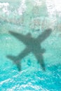 Travel traveling vacation sea symbolic picture airplane flying copyspace copy space Seychelles portrait format water Royalty Free Stock Photo
