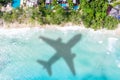 Travel traveling vacation sea symbolic picture airplane flying Seychelles beach water Royalty Free Stock Photo