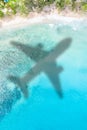 Travel traveling vacation sea symbolic picture airplane flying Seychelles portrait format beach water Royalty Free Stock Photo