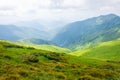 Travel, trekking, nature. Majestic, high green mountains. Horizontal frame Royalty Free Stock Photo