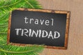 Travel Trinidad palm trees and blackboard on sandy beach Royalty Free Stock Photo