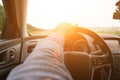 Travel trip car. Happy young man inside vehicle driving in sunny day. Fun driver ride in summer vacation concept. Royalty Free Stock Photo