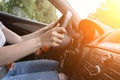 Travel trip car. Happy young woman inside vehicle driving in sunny day. Fun driver ride in summer vacation concept Royalty Free Stock Photo