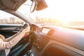 Travel trip car. Happy young woman inside vehicle driving in sunny day. Fun driver ride in winter vacation concept Royalty Free Stock Photo