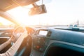 Travel trip car. Happy young woman inside vehicle driving in sunny day. Fun driver ride in winter vacation concept Royalty Free Stock Photo