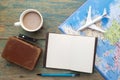 Travel , trip vacation, tourism mockup - close up note book, suitcase, toy airplane and touristic map on wooden table. Royalty Free Stock Photo