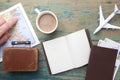 Travel , trip vacation, tourism mockup - close up note book, suitcase, toy airplane and touristic map on wooden table. Royalty Free Stock Photo